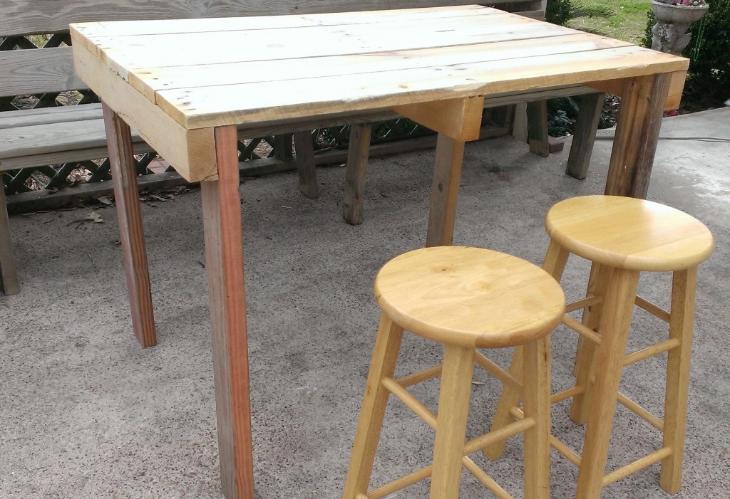 the outdoor pub table is ready to be finished