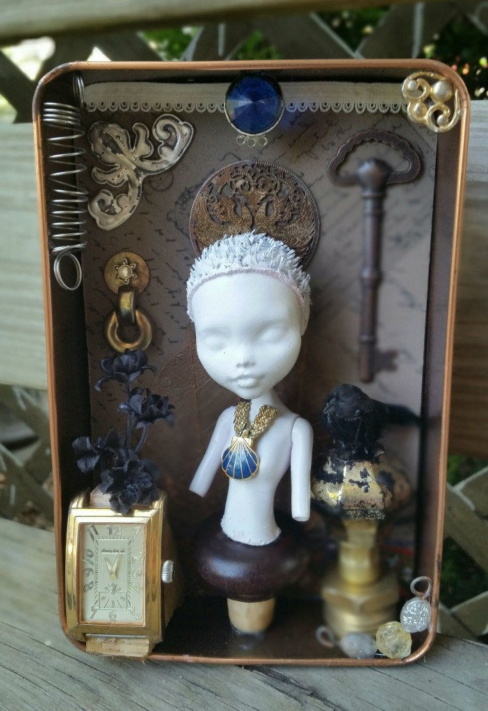 an ornate semi-steampunk doll assemblage