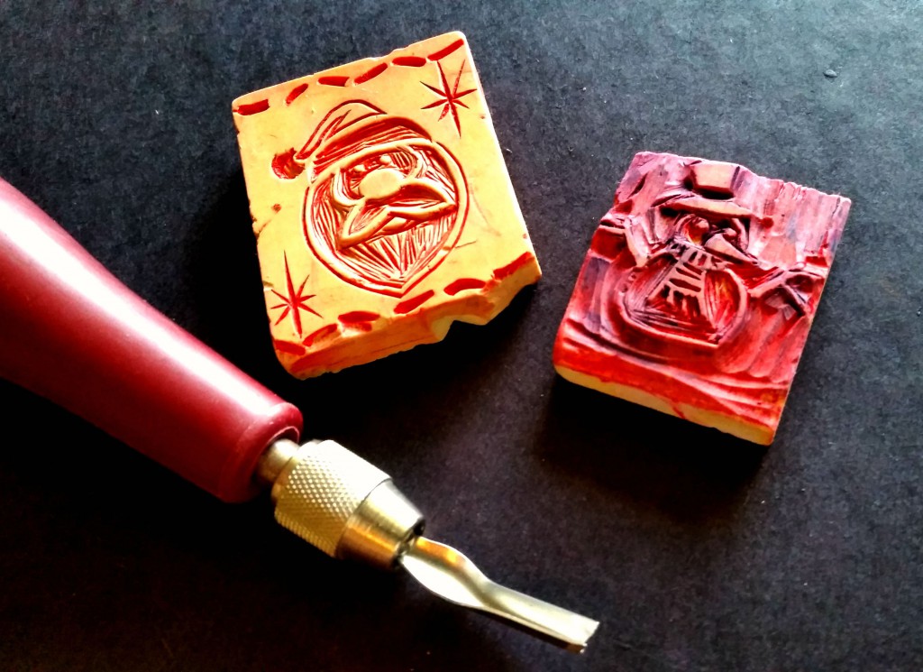 two hand-carved winter-themed stamps